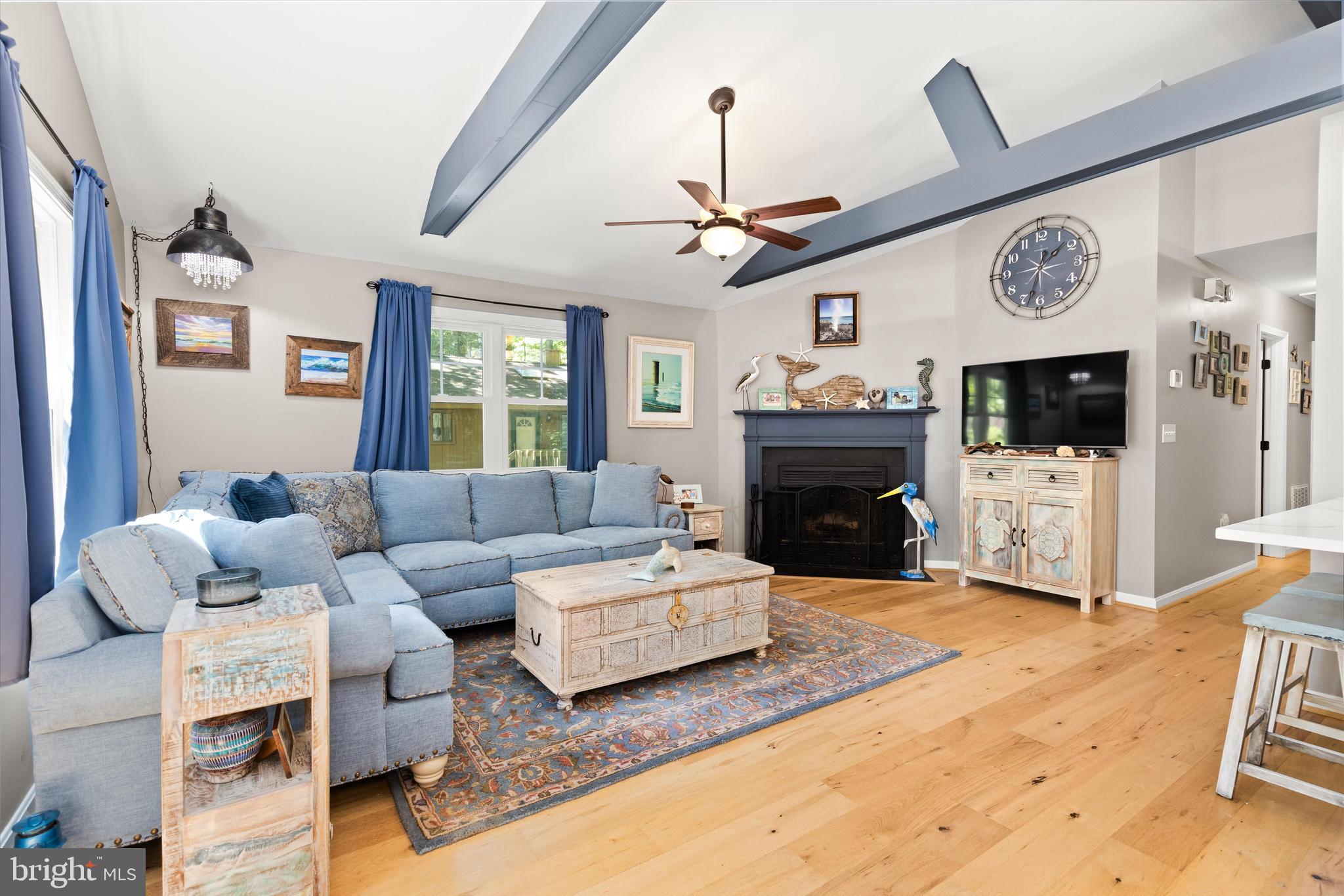 4 Haven End Ocean Pines, MD 21811 - Photo 7 of 37 a living room with furniture flat screen tv and a fireplace