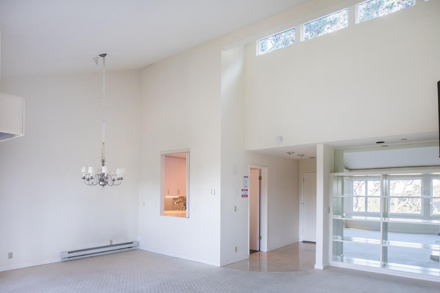 27 Shepherds Knoll Road, Unit 27 Monterey, CA 93940 - Photo 6 of 11 a view of a chandelier fan and windows in a room
