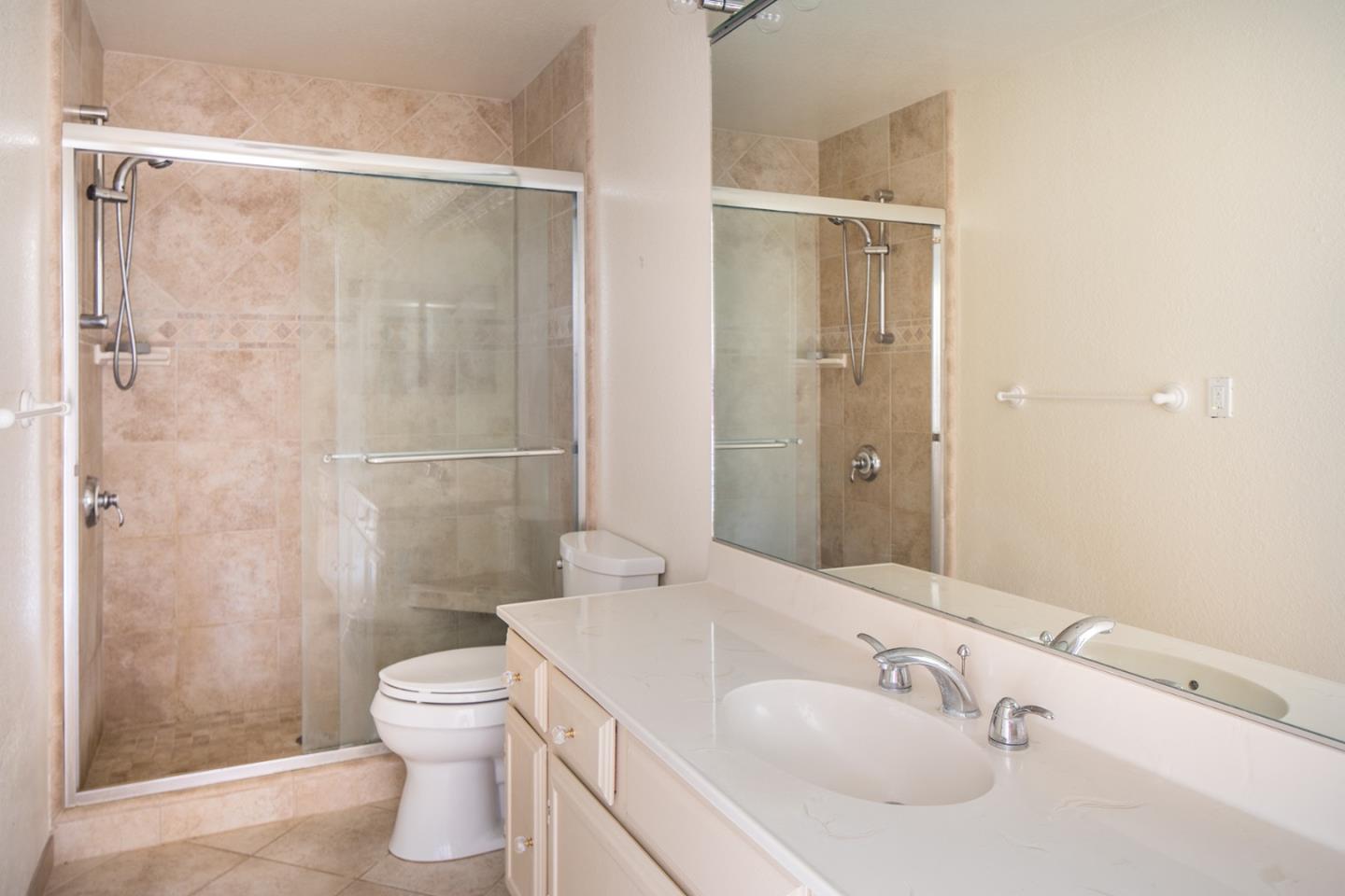 27 Shepherds Knoll Road, Unit 27 Monterey, CA 93940 - Photo 9 of 11 a bathroom with a sink toilet and shower