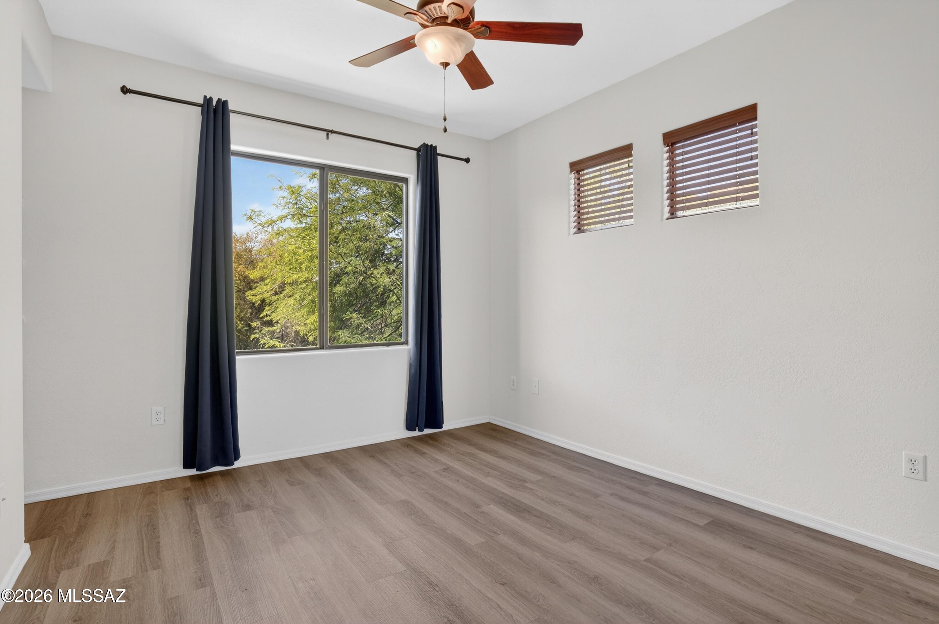 2550 East River Road, Unit 4204 Tucson, AZ 85718 - Photo 23 of 36 a view of an empty room with a window