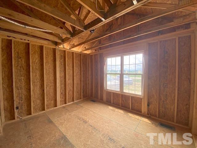 151 Mamie Road Benson, NC 27504 - Photo 12 of 33 a view of an empty room with a window