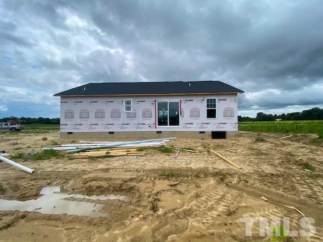 151 Mamie Road Benson, NC 27504 - Photo 16 of 33 a view of a house with swimming pool and sitting area