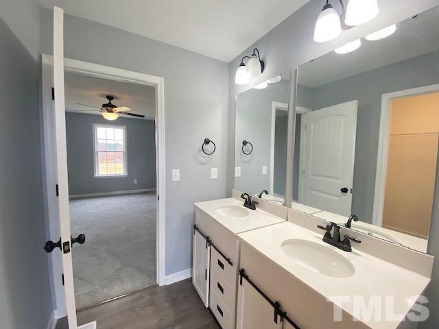 151 Mamie Road Benson, NC 27504 - Photo 22 of 33 a bathroom with double vanity and a mirror