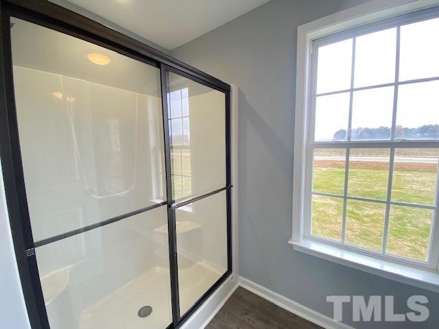 151 Mamie Road Benson, NC 27504 - Photo 23 of 33 a bathroom with a glass shower door