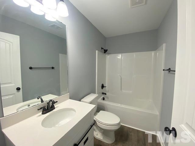 151 Mamie Road Benson, NC 27504 - Photo 27 of 33 a bathroom with a sink toilet and shower