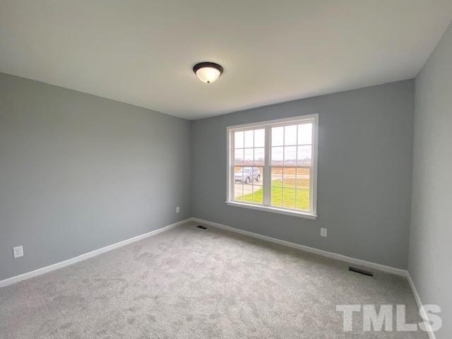 151 Mamie Road Benson, NC 27504 - Photo 29 of 33 a view of an empty room with a window