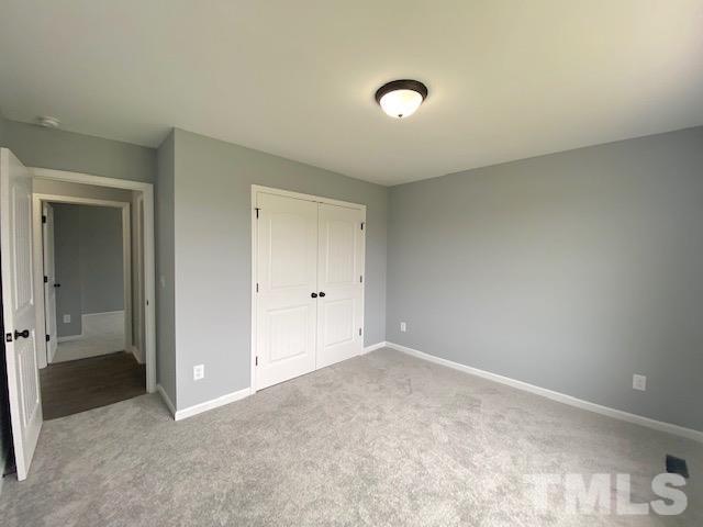151 Mamie Road Benson, NC 27504 - Photo 30 of 33 an empty room with closet area