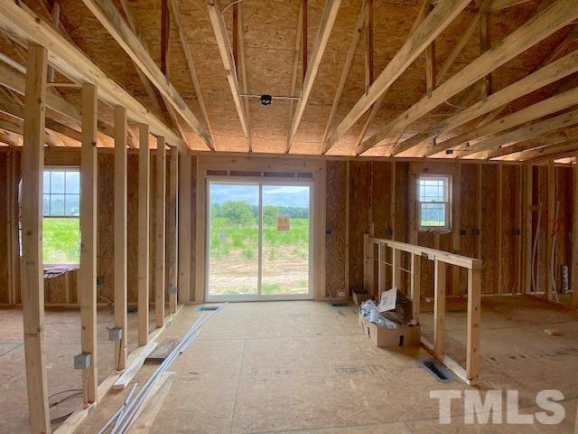 151 Mamie Road Benson, NC 27504 - Photo 7 of 33 a big room with wooden floor and windows