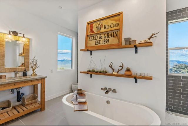 a bathroom with a bathtub a sink and a toilet