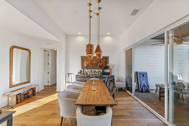 a view of a chairs and table in patio with a lake view
