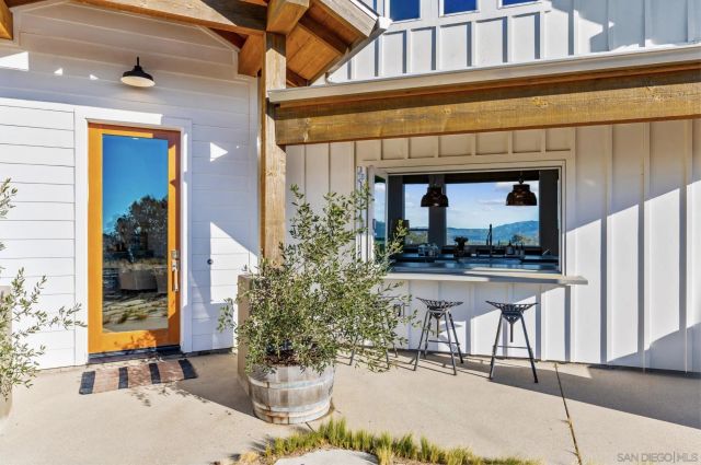 a view of a balcony with furniture