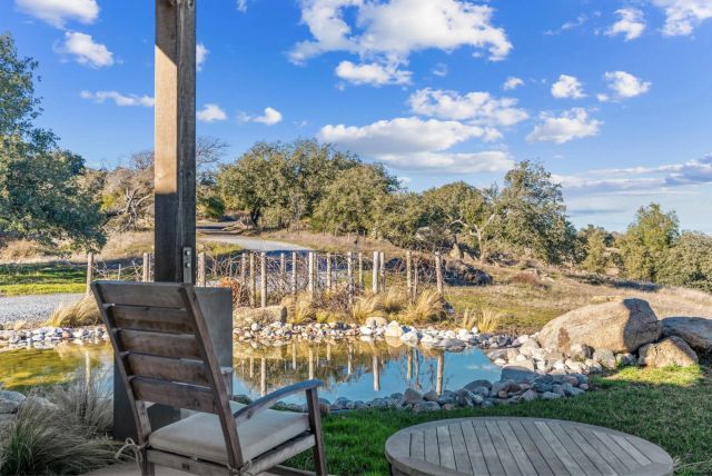 a view of a balcony with furniture