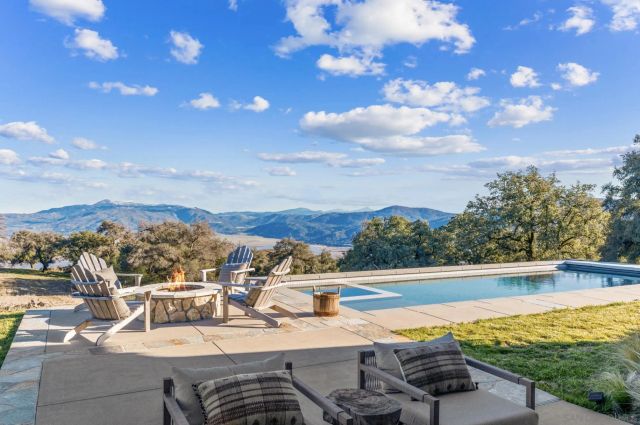 a view of a house with a yard and garage