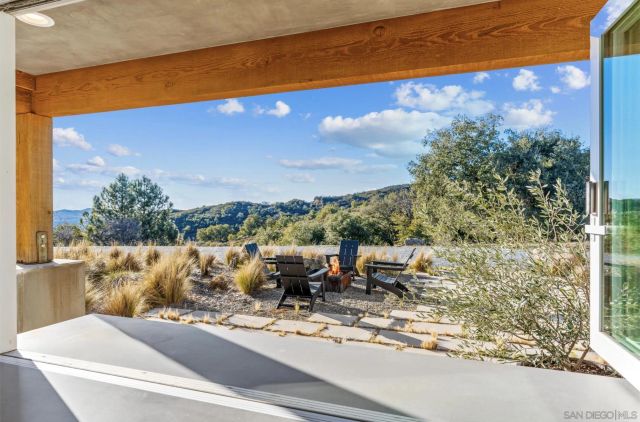 a front view of house with yard and swimming pool