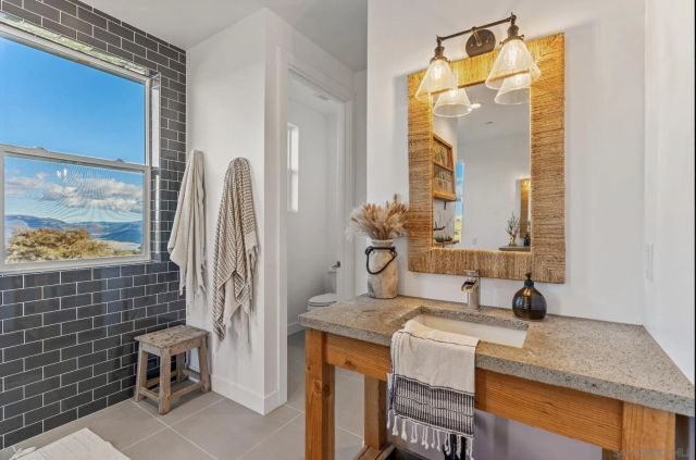 a bedroom with a bed and a television