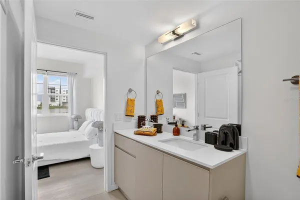 a bathroom with a sink double vanity and tub