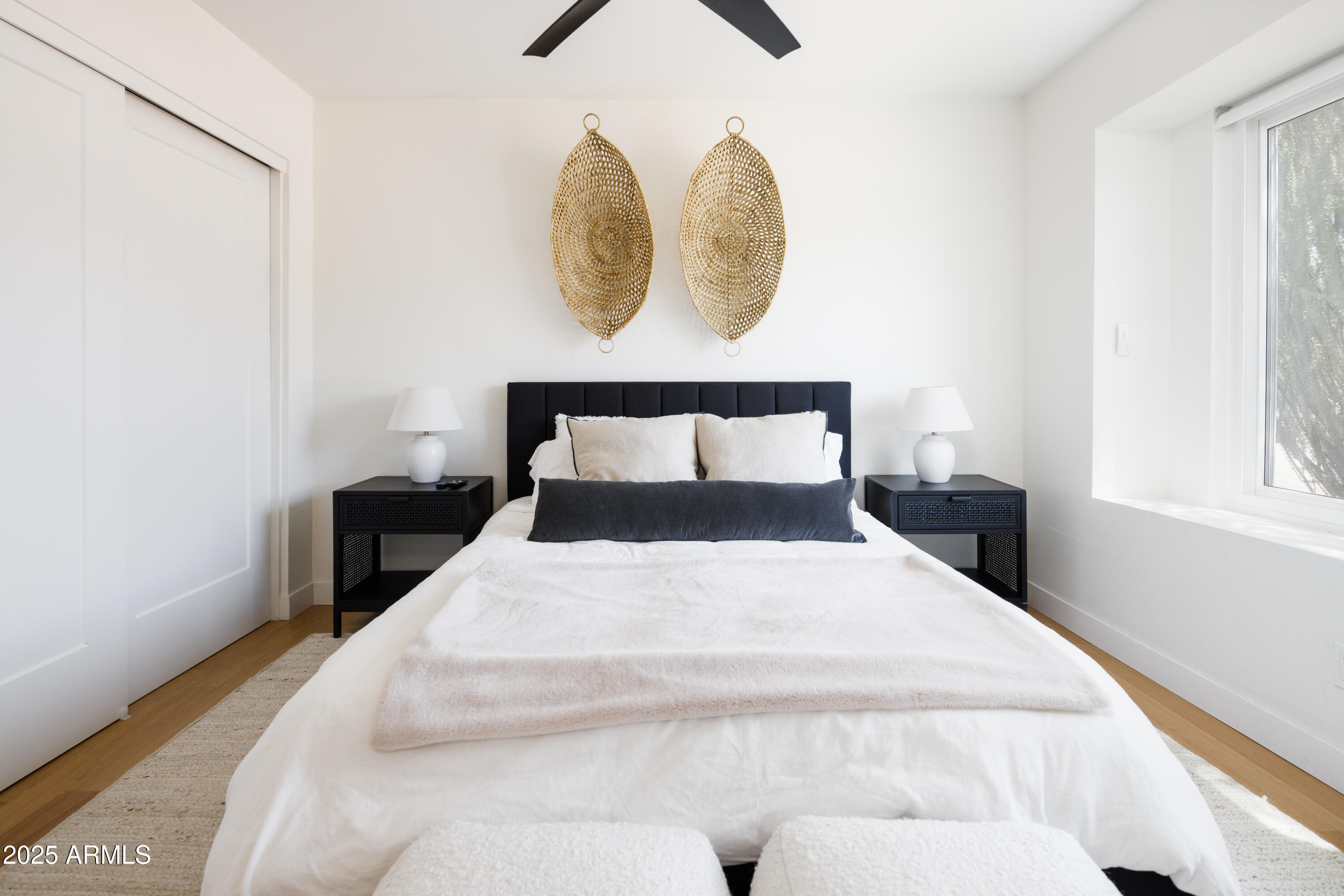5502 East Grandview Road Scottsdale, AZ 85254 - Photo 27 of 42 a bedroom with a bed and a painting on the wall