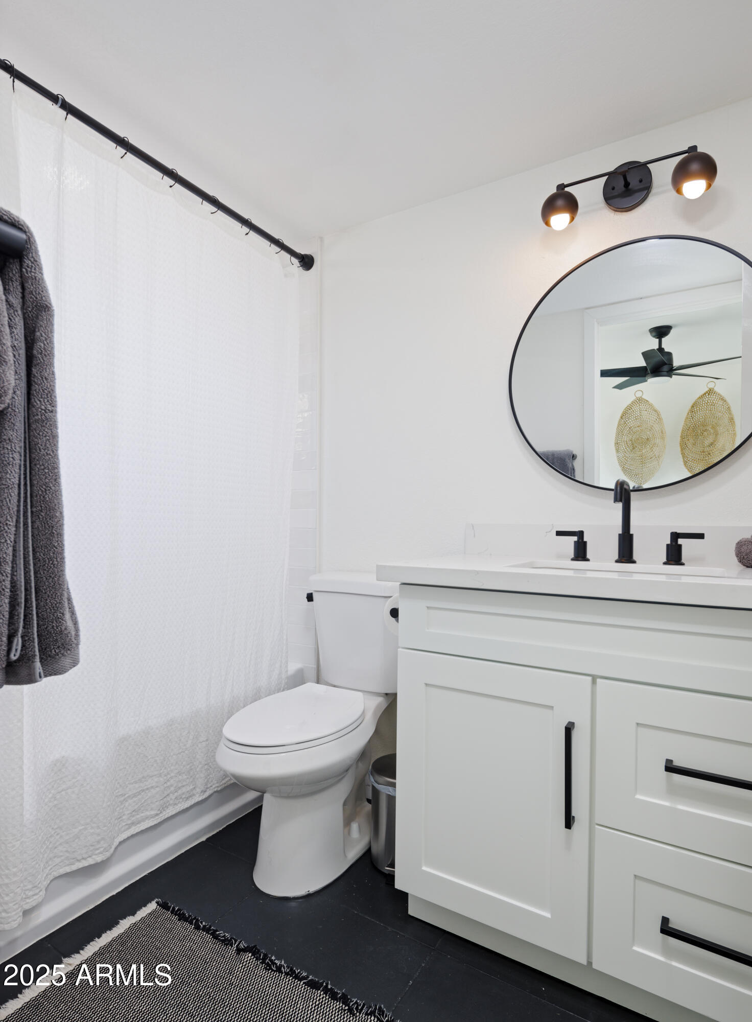 5502 East Grandview Road Scottsdale, AZ 85254 - Photo 28 of 42 a bathroom with a sink toilet and vanity