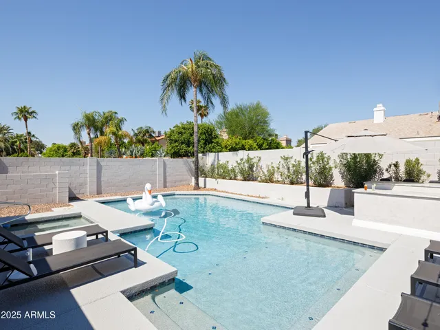 a view of a patio with swimming pool