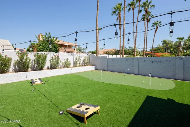 a view of yard with swimming pool