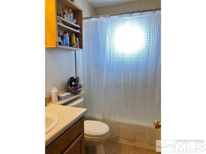 4985 West 7th Street, Unit 2 Reno, NV 89503 - Photo 6 of 11 a bathroom with a sink a toilet and shower