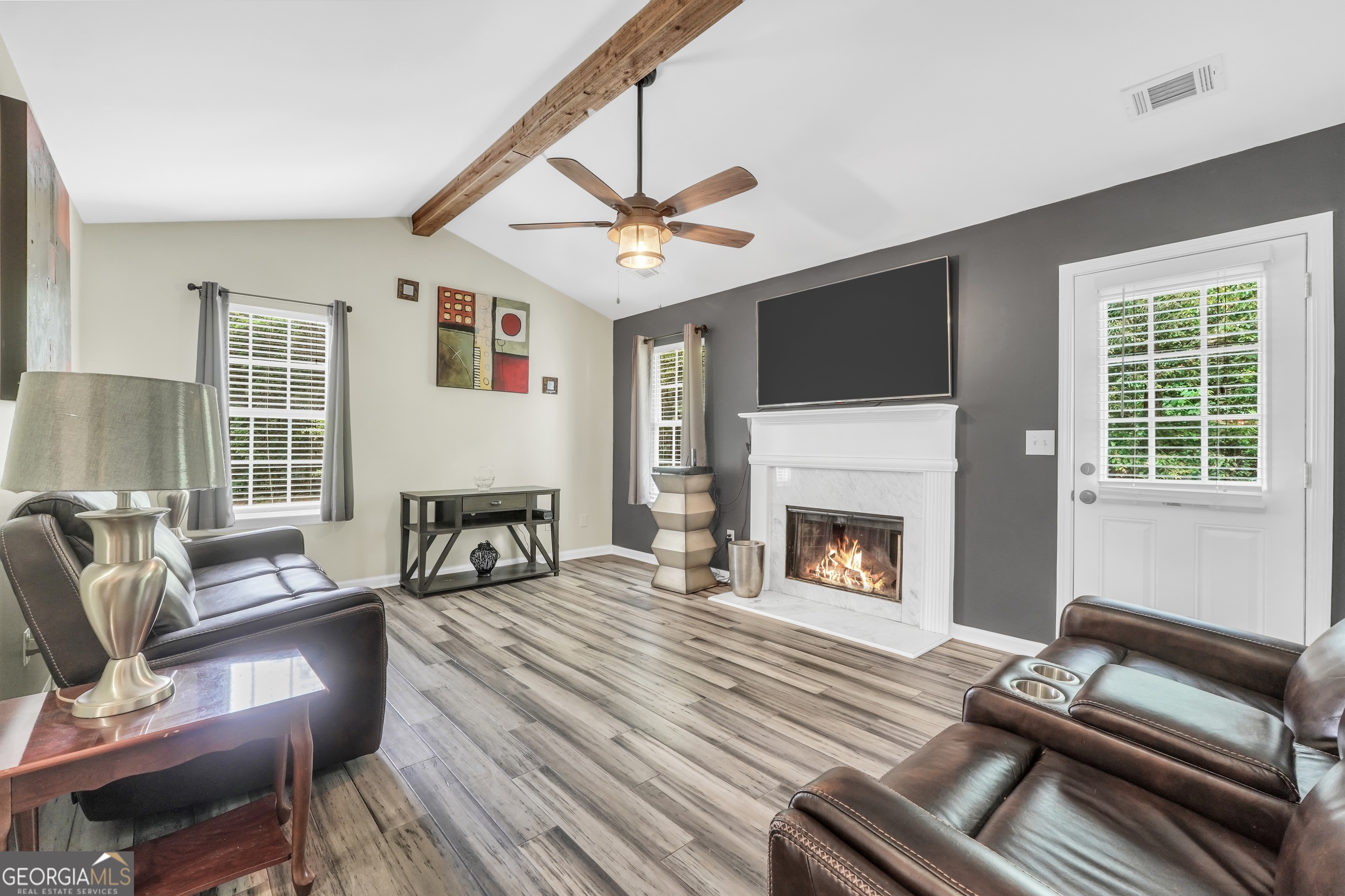 110 Westeria Way Jackson, GA 30233 - Photo 7 of 45 a living room with furniture fireplace and flat screen tv