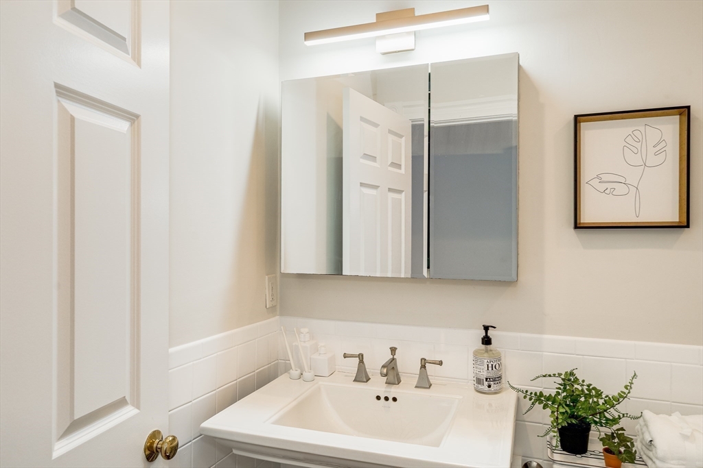 705 Massachusetts Avenue, Unit 6 Boston, MA 02118 - Photo 6 of 14 a bathroom with a sink and a bathtub