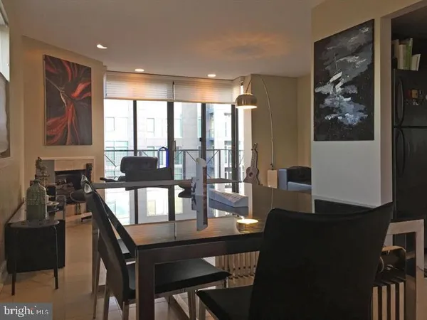 a view of a dining room with furniture and window