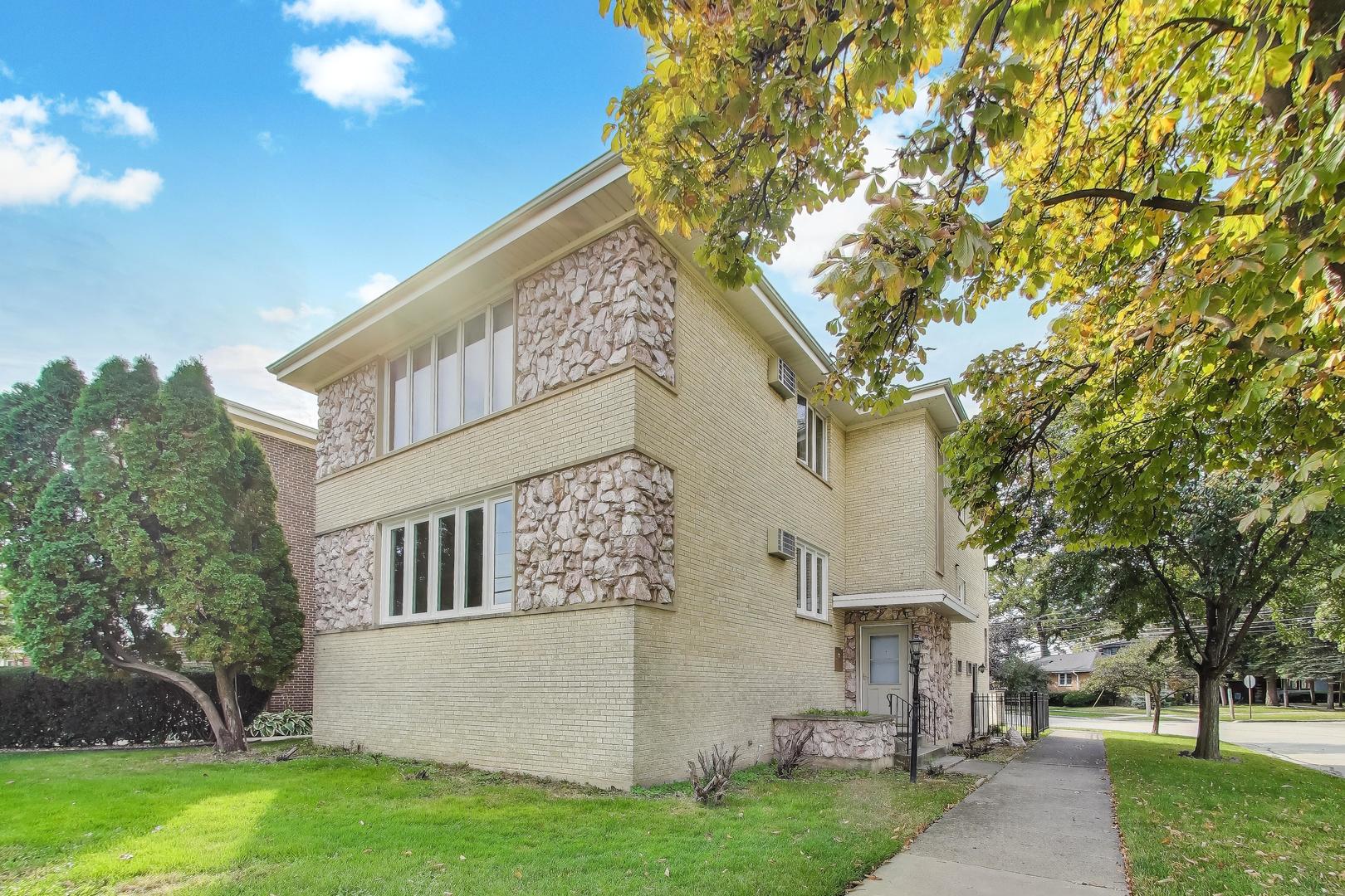 a view of house with a yard