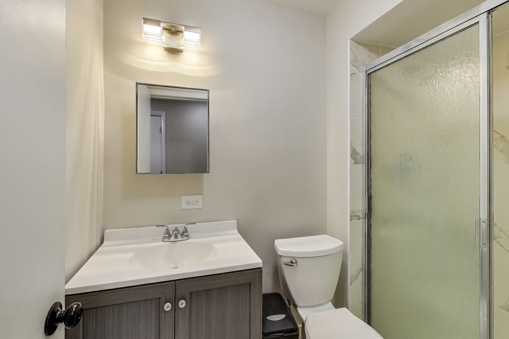 1086 North Northwest Highway, Unit G Park Ridge, IL 60068 - Photo 11 of 13 a bathroom with a sink toilet and a mirror