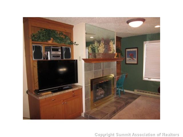 108 Guller Road, Unit A5 Frisco, CO 80443 - Photo 4 of 25 Living Room. Gas for your fireplace is included in your low HOA dues! Custom built-ins on both sides of the fireplace.