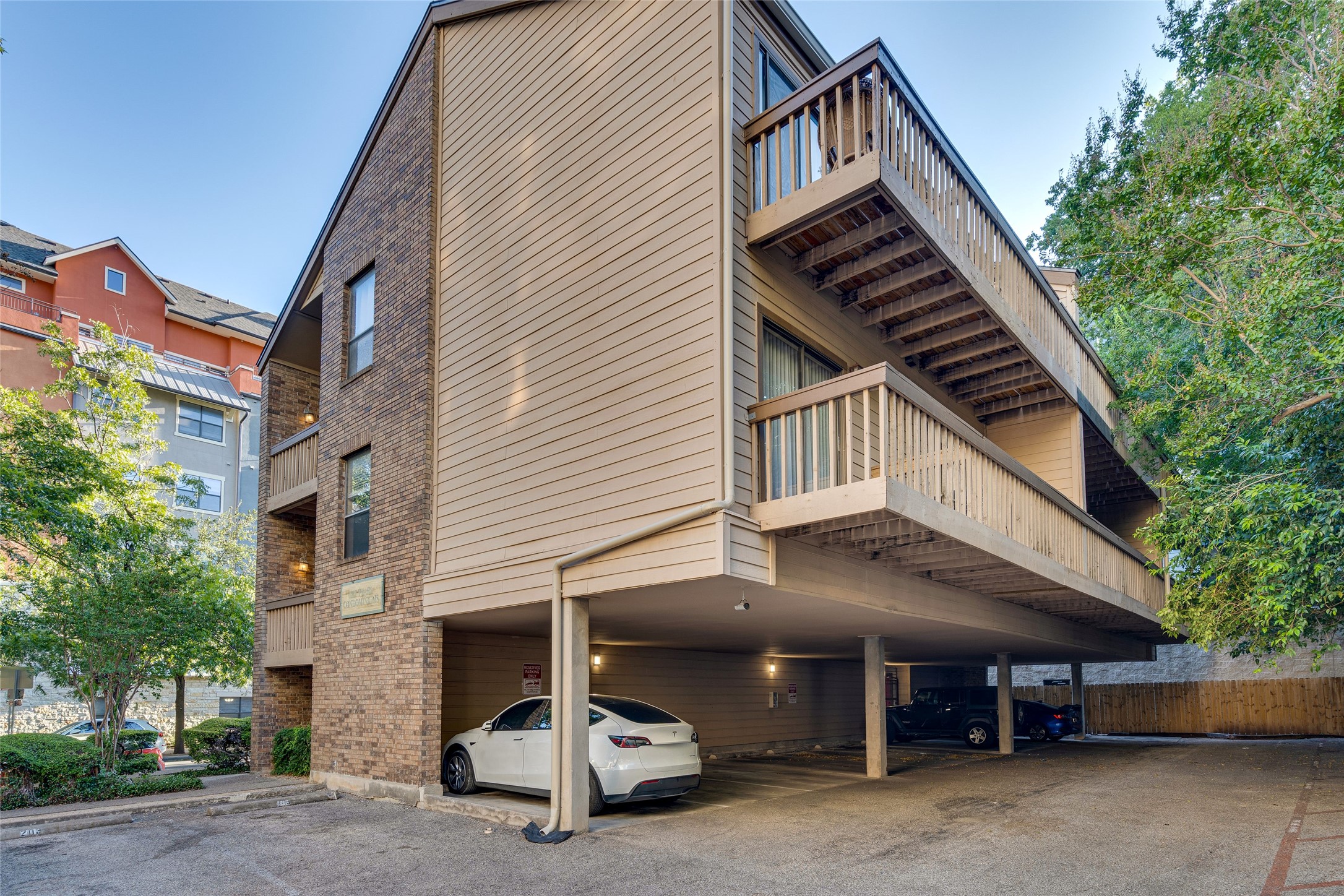 a view of a car park in front of house