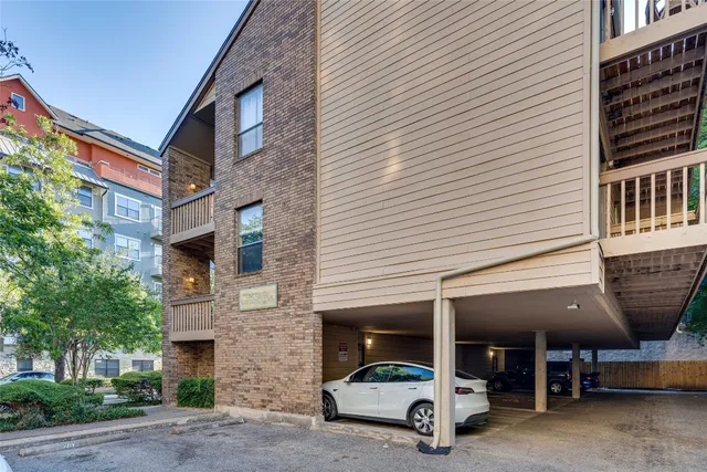 a view of a building with sitting area