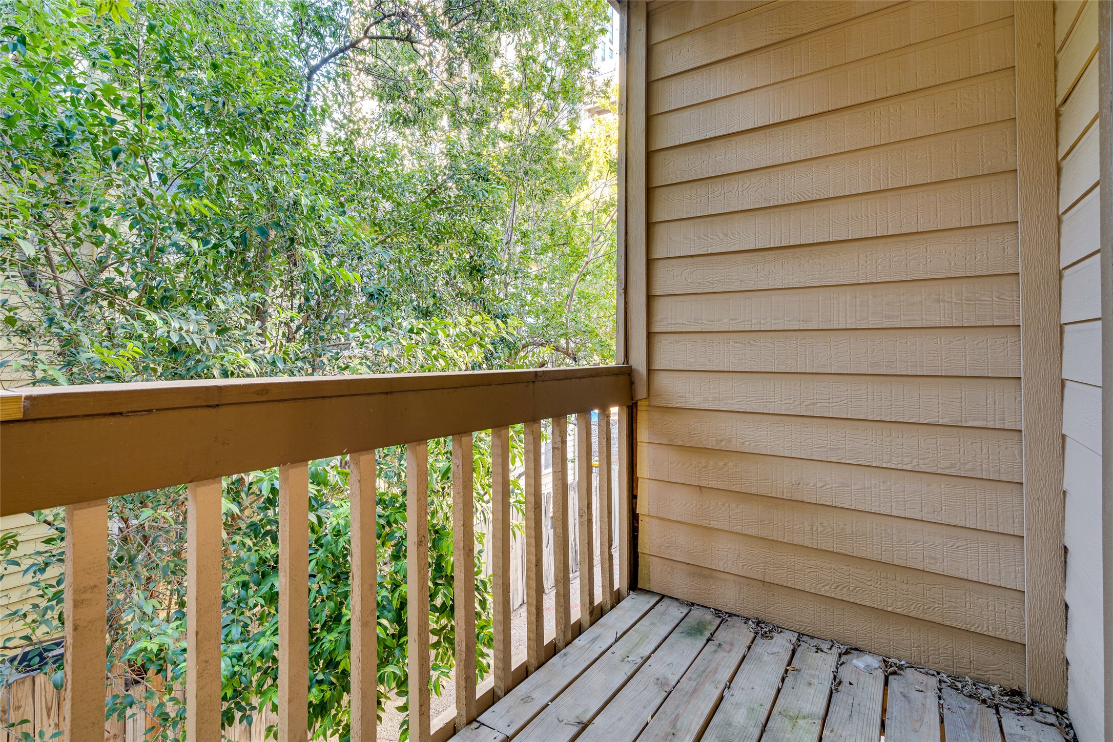 2210 Pearl Street, Unit 203 Austin, TX 78705 - Photo 22 of 22 a view of a balcony with wooden floor