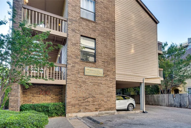a car parked in front of a house