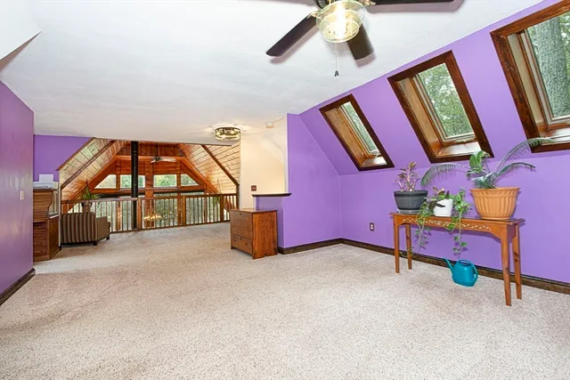 a view of an empty room with windows