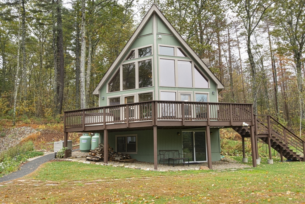 17 West Shore Drive Ashburnham, MA 01430 - Photo 2 of 42 a view of a house with backyard porch and sitting area