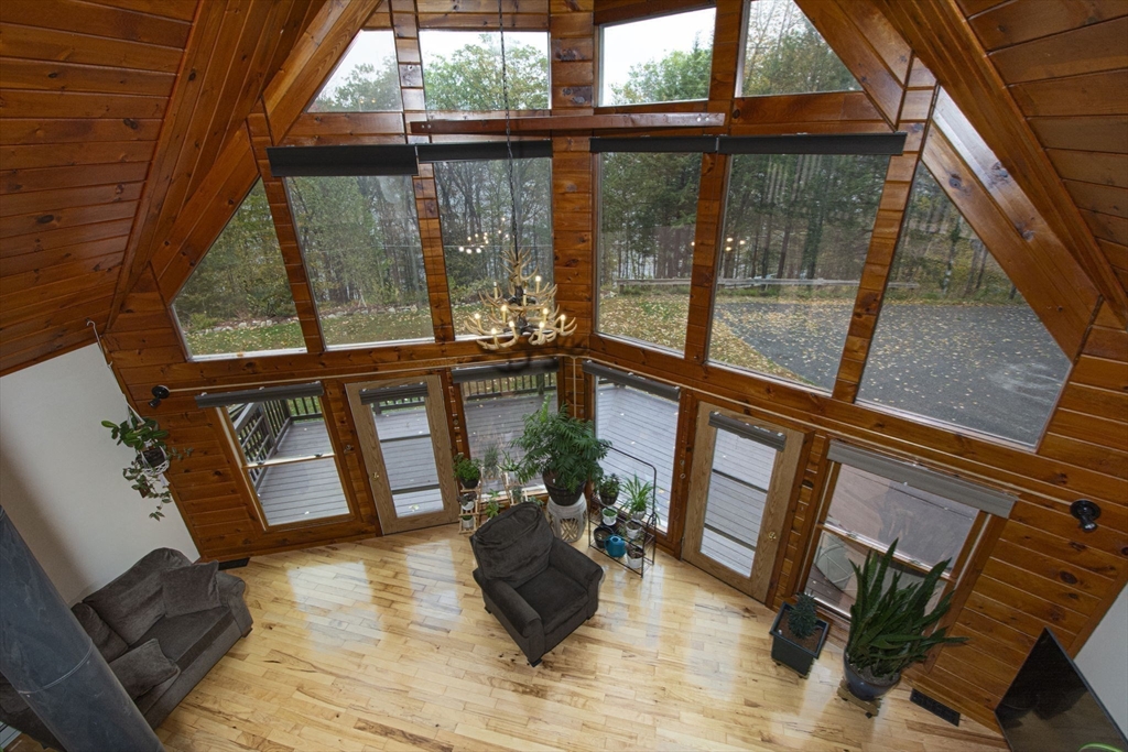 17 West Shore Drive Ashburnham, MA 01430 - Photo 21 of 42 a living room with furniture and a large window