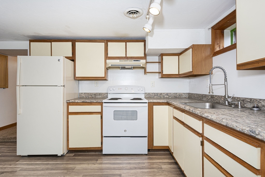 17 West Shore Drive Ashburnham, MA 01430 - Photo 24 of 42 a kitchen with a white cabinets and white appliances