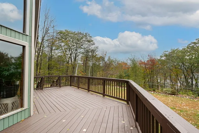 a view of a balcony with wooden floor