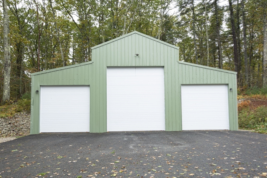 17 West Shore Drive Ashburnham, MA 01430 - Photo 36 of 42 a house with trees in the background