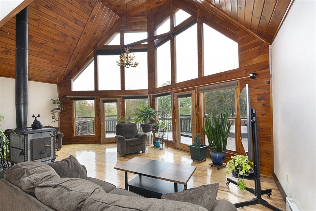 17 West Shore Drive Ashburnham, MA 01430 - Photo 5 of 42 a living room with furniture and a large window