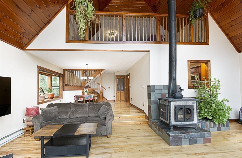 17 West Shore Drive Ashburnham, MA 01430 - Photo 8 of 42 a living room with furniture and a fireplace