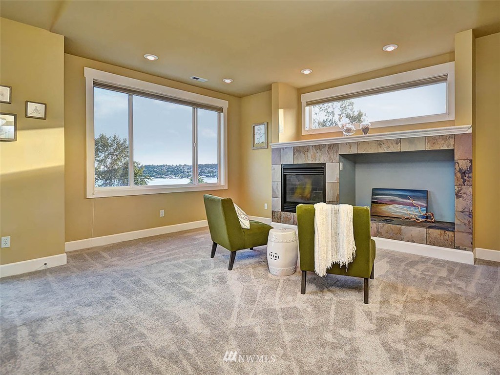 906 North 27th Place Renton, WA 98056 - Photo 11 of 25 a living room with furniture and a fireplace