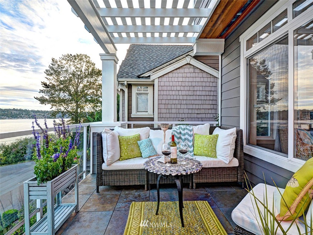 906 North 27th Place Renton, WA 98056 - Photo 15 of 25 a view of a patio with couches table and chairs and potted plants