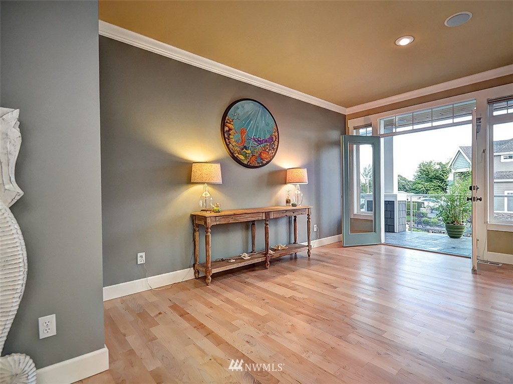 906 North 27th Place Renton, WA 98056 - Photo 19 of 25 a view of a room with wooden floor and iron gate