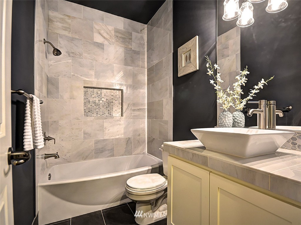 906 North 27th Place Renton, WA 98056 - Photo 21 of 25 a bathroom with a sink a toilet and a bathtub