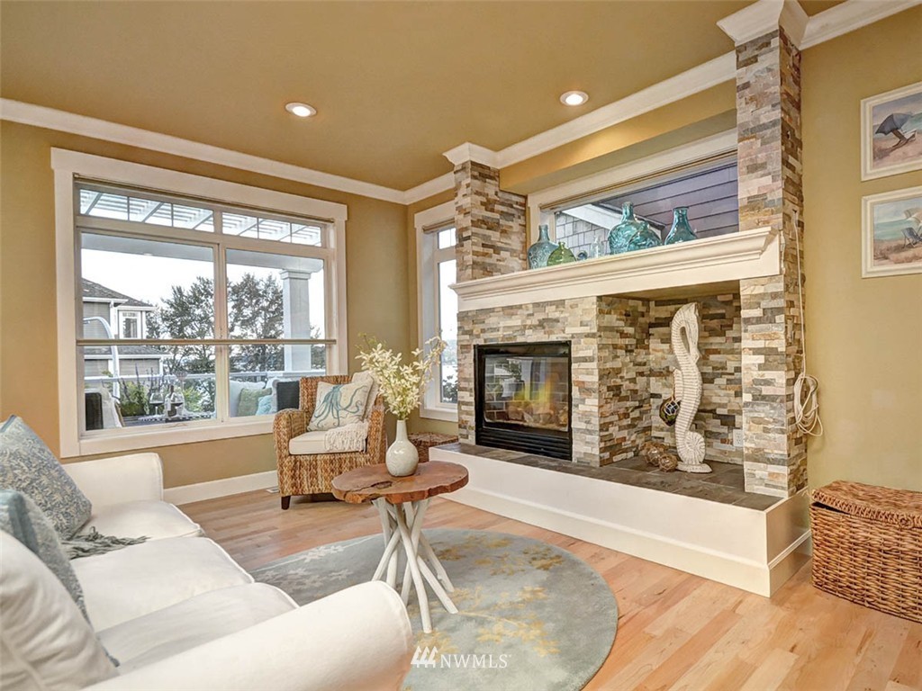 906 North 27th Place Renton, WA 98056 - Photo 8 of 25 a living room with furniture and a fireplace