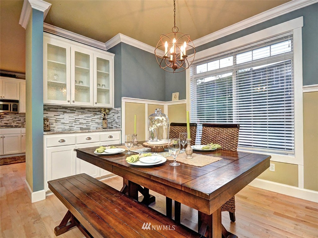 906 North 27th Place Renton, WA 98056 - Photo 9 of 25 a view of a dining room with furniture and chandelier