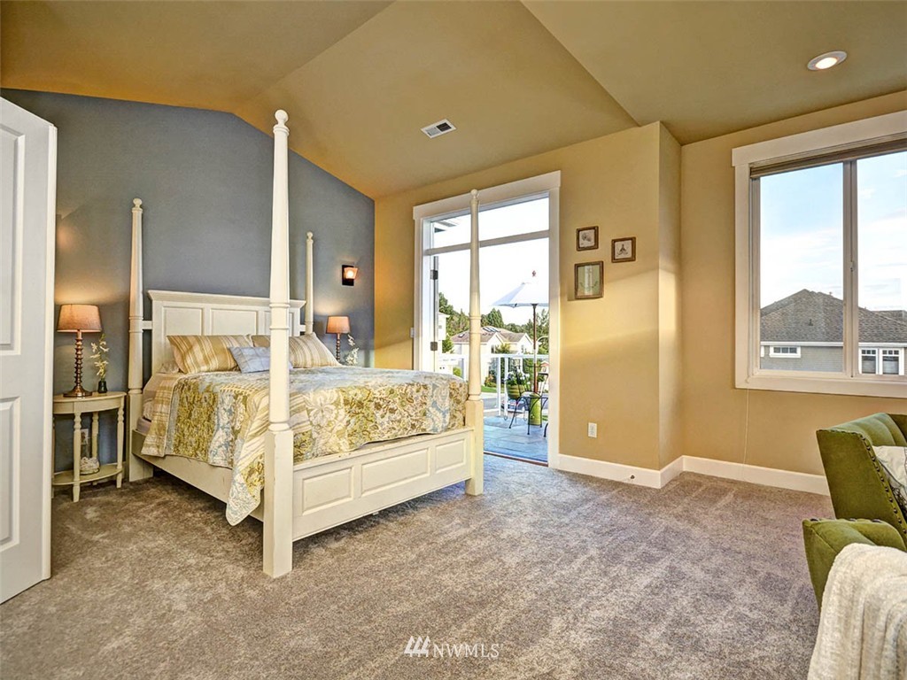 906 North 27th Place Renton, WA 98056 - Photo 10 of 25 a bed sitting in a spacious bedroom next to a window